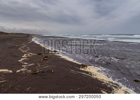 View Of The Waved Waves Of The Avachinskaya Bay , Avacha Bay And Volcanic Beaches. Kamchatka Peninsu