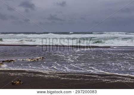 View Of The Waved Waves Of The Avachinskaya Bay , Avacha Bay And Volcanic Beaches. Kamchatka Peninsu