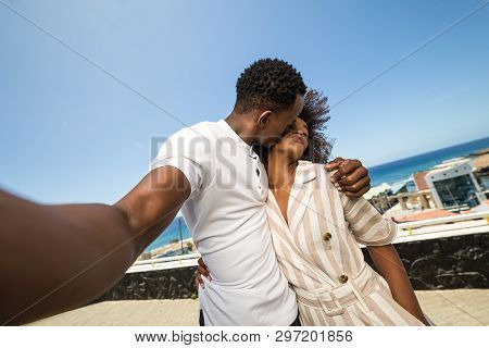 Outdoor Protrait Of Black African American Couple  Taking A Selfie