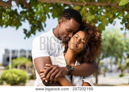Outdoor Protrait Of Black African American Couple Embracing Each Other