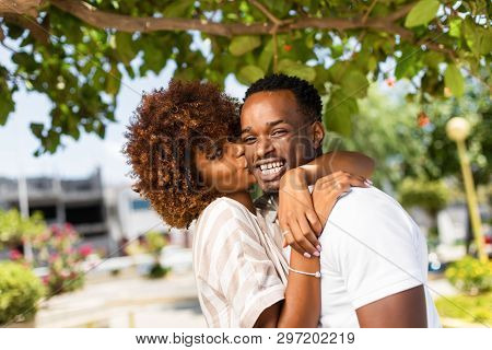 Outdoor Protrait Of Black African American Couple Kissing Each Other