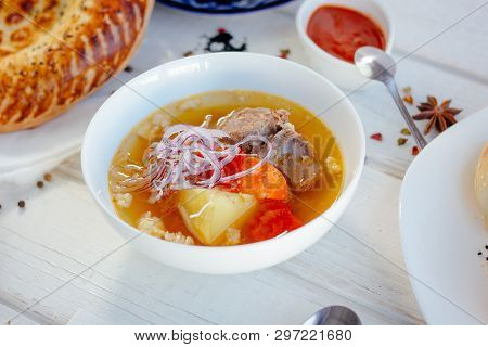 Uzbek Chorba - Soup From Fresh Meat And Vegetables On White Table, Great Image For Your Needs.