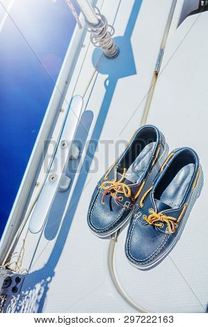 A Pair Of Topsider On White Yacht Deck. Yachting