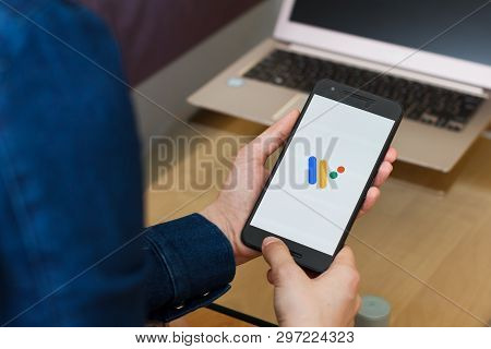 San Francisco, Us - 22 April 2019: Close Up To Female Hands Holding Smartphone Using Wear Os By Goog