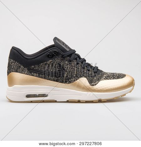Vienna, Austria - August 7, 2017: Nike Air Max 1 Ultra 2.0 Flyknit Black And Gold Sneaker On White B