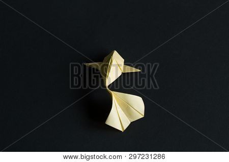 Handmade Paper Craft Origami Gold Koi Carp Fishes On Black Background.top View, Pattern