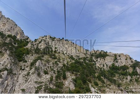 Ropes Tourist Suspension Lift Climb To The Top Of The High Crimean Mountain Ai-petri. The Rocks Are 