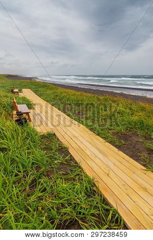 Wooden Footbridges And Benches Along The Volcanic Beach, Waved Waves Of The Avachinskaya Bay , Avach