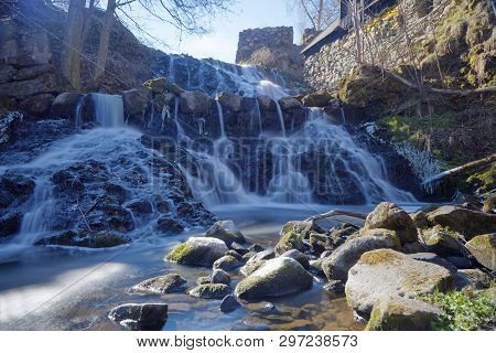 Beautful Waterfall In Blue Shades In The Swedish Village Rottle During Spring