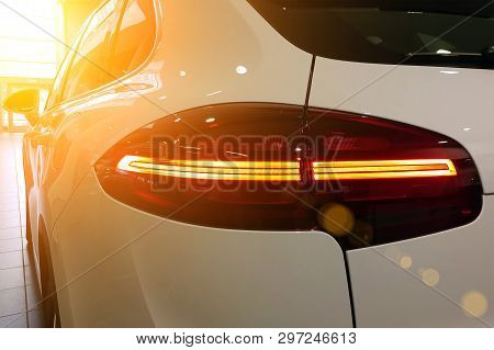 Closeup Of White Premium Suv On A Luxury Indoor Parking. Taillights, Rear View Mirrors, Left Side Of