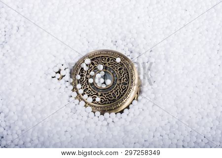 Retro Pocket Watch On White Polystyrene Balls