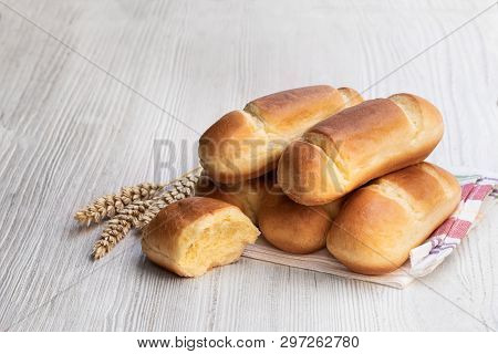 Mini  Brioche Bun In Paper Bag Isolated On White
