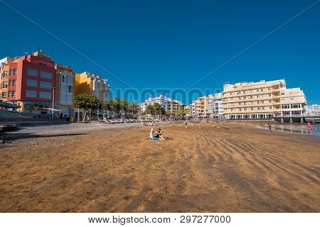 El Medano, Spain - April 11, 2018: Tourist Relaxing In El Medano Beach, Tenerife, Canary Islands, Sp