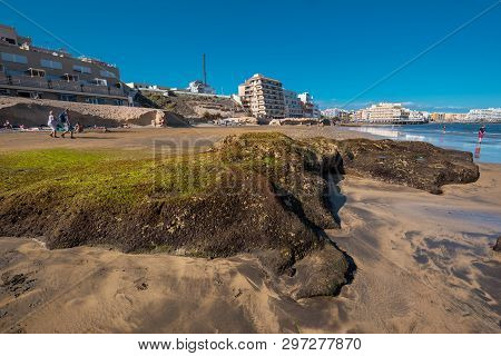 El Medano, Spain - April 11, 2018: Tourist Relaxing In El Medano Beach, Tenerife, Canary Islands, Sp