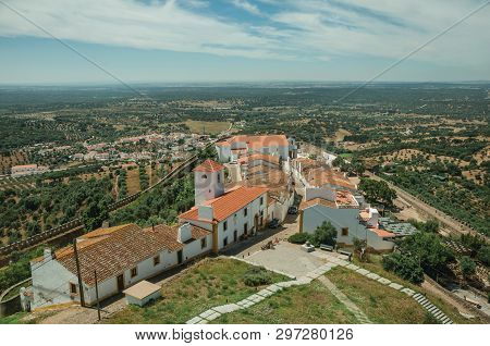 View Of The Small Village Main Street And Countryside Landscape With Green Hills At Evoramonte. A Ti
