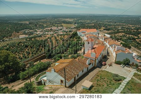 View Of The Small Village Main Street And Countryside Landscape With Green Hills At Evoramonte. A Ti
