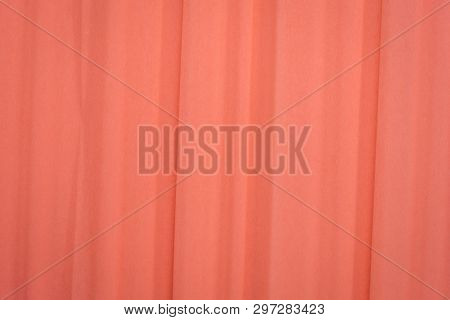 salmon color crepe paper - background with crinkled texture