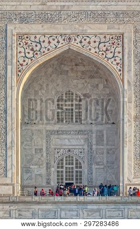 Agra, India - March 5 2018: Tourists Sighteseeing, Exploring And Admiring Famous The Taj Mahal