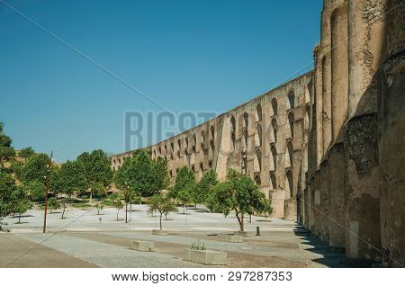 Amoreira Aqueduct With Arches And Rectangular Pillars In Front Of Wooden Square At The Western Entra
