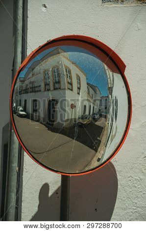 Old Building On Empty Alley Corner Reflected In Street Mirror, In A Sunny Day At Campo Maior. A Cute
