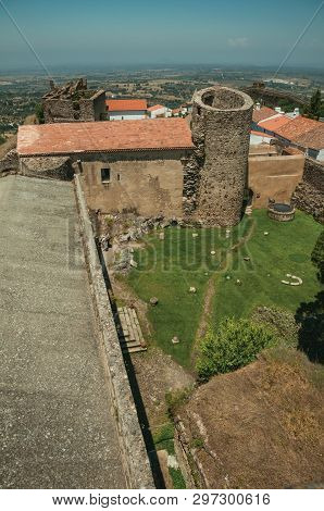 Green Lawn On Castle Central Courtyard Among Stone Walls And Round Tower, In A Sunny Day At Castelo 