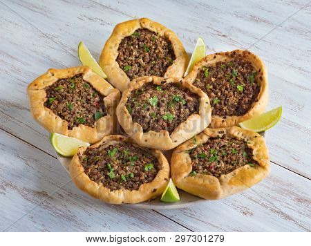 Arabic Meat Sfiha Over A Wooden Table. Top View Of Arabic Esfiha.