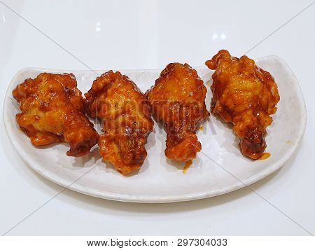 Korean Food Style, Top View Of Spicy Chicken On White Plate In Restaurant, Yangnyeom Tongdak Is Kore