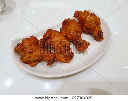 Korean Food Style, Top View Of Spicy Chicken On White Plate In Restaurant, Yangnyeom Tongdak Is Kore