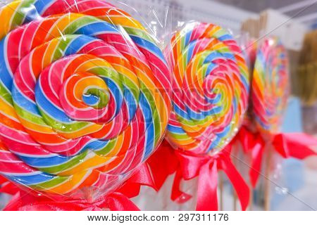 Rainbow Lollipop Swirl On Wooden Stick In Candy Store, Selective Focus.sweet Candy.candy Bar.lollipo