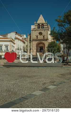 Elvas, Portugal - July 07, 2018. Large signpost with the city name and church of Our Lady of the Assumption at Elvas. A gracious star-shaped fortress city on the easternmost frontier of Portugal.