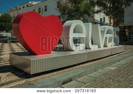 Elvas, Portugal - July 07, 2018. Large signpost with the city name in a sunny square of Elvas. A gracious star-shaped fortress city on the easternmost frontier of Portugal.