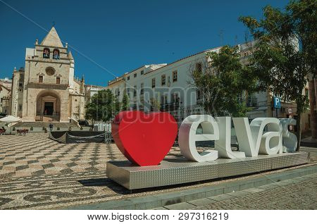 Elvas, Portugal - July 07, 2018. Large signpost with the city name and church of Our Lady of the Assumption at Elvas. A gracious star-shaped fortress city on the easternmost frontier of Portugal.