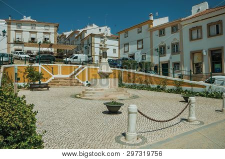 Castelo De Vide, Portugal - July 10, 2018. Old Colorful Houses Around Square With Marble Statue At C