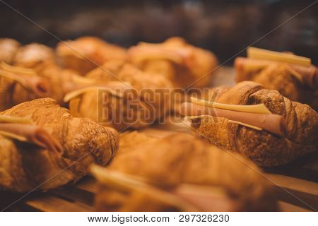 Сroissant With Ham And Cheese. Delicious Fresh In A Bakery Shop.