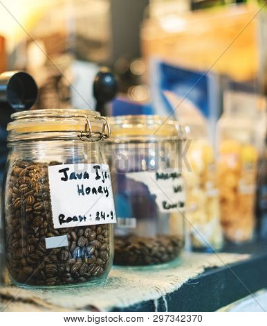 Coffee Bean In Glass Jar. Arabica Coffee Bean Variant Java Ijen Raung With Roast Honey Process To En