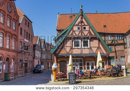 Lauenburg, Germany - April 16, 2019: People Enjoying The Sun At A Cafe In Lauenburg, Germany