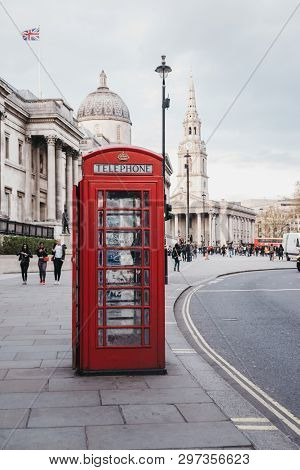 London, Uk - April 13, 2019: Red Phone Box On Pall Mall East, National Gallery On The Background. Re