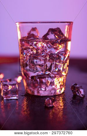 Glass Of Pure Water With Ice Cubes.abstract Dynamic Backdrop For Your Design