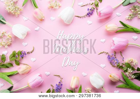 Happy Mothers Day Concept. Top View Of Pink Tulip Flowers In Frame With Happy Mother's Day Text On P