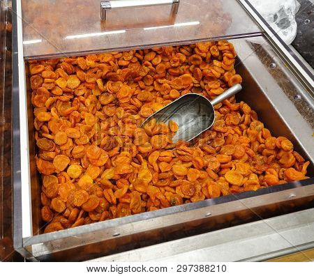 Dried Apricots With A Large Metal Spoon / Scoop Ready To Be Sold Unpackaged To The Environmentally C