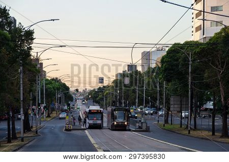 Melbourne, Australia - March 7, 2019: Trams Travelling Along Flemington Road Bisecting Parkville And