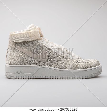 Vienna, Austria - August 7, 2017: Nike Air Force 1 Ultra Flyknit Mid Beige And White Sneaker On Whit