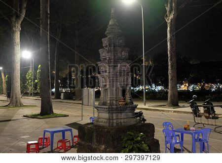 Siem Reap, Cambodia, December 13, 2018 A Small Buddhist Altar In The Park. A Table And Several Plast