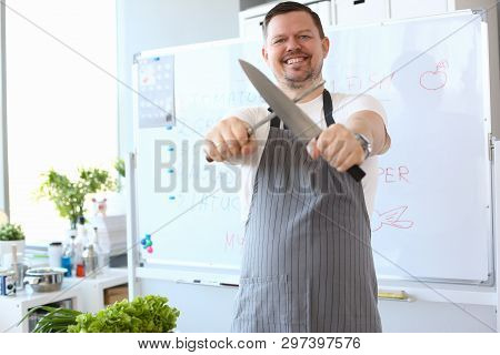 Blogger Chef Sharpening Steel Knife Photography. Culinary Man Whetting Blade Of Kitchenware Manually
