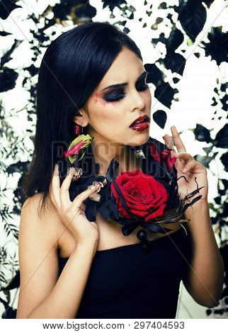 Pretty Brunette Woman With Rose Jewelry, Black And Red, Bright Make Up Kike A Vampire Closeup Red Li