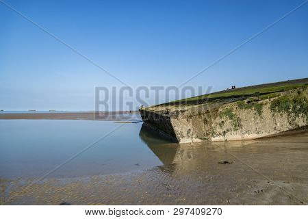 The Remains Of The Mulberry Harbour At Arromanches, Normandy France