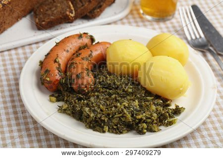 Roasted sausages, kale, and boiled potatoes, the traditional German dish