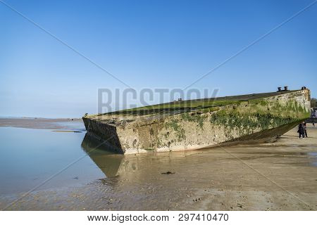 The Remains Of The Mulberry Harbour At Arromanches, Normandy France
