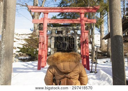 Asian Woman Is Enjoy Traveling At Tsuruga-jo Castle In Fukushima, Japan During Winter.