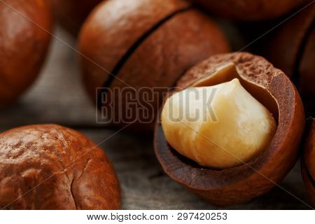 Macadamia Nut On A Wooden Table In A Bag, Closeup, Top View
